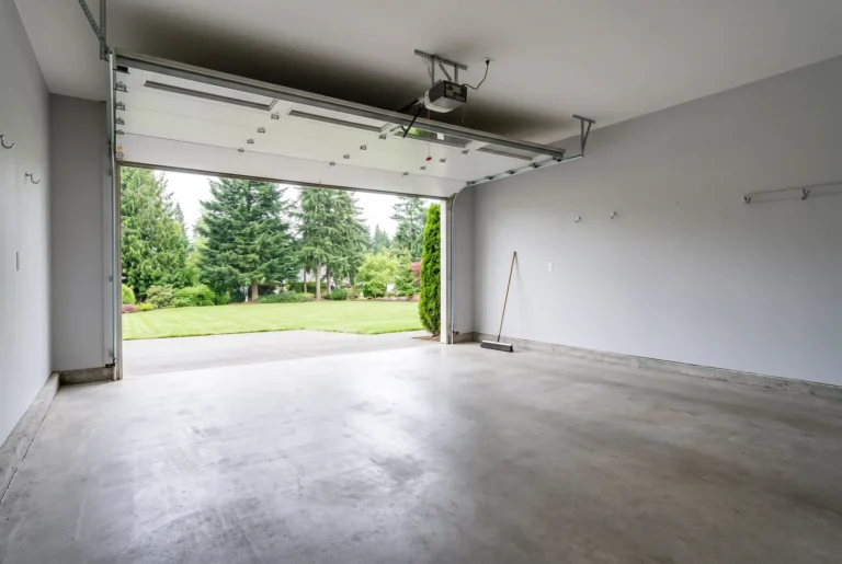 Empty, swept two-car garage after a full clear-out
